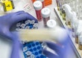 Nurse shakes vial mixing medication Coronavirus covid-19 experimental vaccine in a laboratory