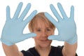 Nurse showing blue latex gloves