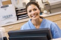 A Nurse Sitting At A Computer Royalty Free Stock Photo