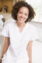 Nurse Sitting On Hospital Bed