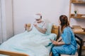 Nurse sitting by old man Royalty Free Stock Photo