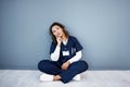 Nurse, sitting or thinking of hospital treatment, medicine innovation or surgery planning on mock up wall. Doctor, woman Royalty Free Stock Photo