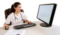 Nurse Sitting and Working at her Computer Royalty Free Stock Photo