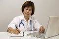 Nurse sitting and writing Royalty Free Stock Photo