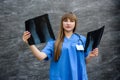 Nurse student examines X-ray of foot. Medical concept