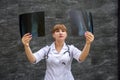 Nurse student examines X-ray of foot. Medical concept