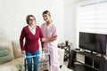 Nurse Supporting Senior Patient At Home