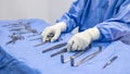 Nurse or surgeon pick up medical equipment on surgical table inside operating room in hospital.People use tool for surgery Royalty Free Stock Photo