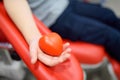 A nurse takes blood from a child. Close up view of kid hand with a bouncy heart shape ball during of taking a blood sample for Royalty Free Stock Photo