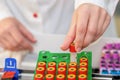 Nurse`s hands taking test tube Royalty Free Stock Photo