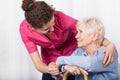 Nurse taking care of senior woman