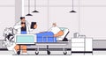 nurse taking care of sick senior man patient lying in hospital bed care service concept clinic ward interior horizontal