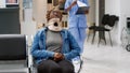 Nurse taking injured patient with medical neck collar to office Royalty Free Stock Photo