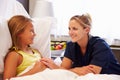 Nurse Talking To Child Patient In Hospital Bed Royalty Free Stock Photo
