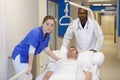 nurse transfer man by stretcher Royalty Free Stock Photo