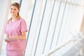 Nurse Using Digital Tablet In Corridor Of Modern Hospital Royalty Free Stock Photo