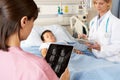 Nurse Using Digital Tablet When Visiting Patient Royalty Free Stock Photo