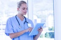 Nurse using her tablet pc Royalty Free Stock Photo