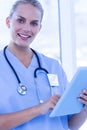 Nurse using her tablet pc Royalty Free Stock Photo
