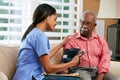 Nurse Visiting Senior Male Patient At Home Royalty Free Stock Photo