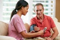 Nurse Visiting Senior Male Patient At Home Royalty Free Stock Photo