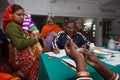 A nurse is waiting to inject a immunisation.