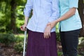 Nurse walking with a female patient with a crutch Royalty Free Stock Photo