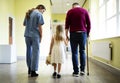 Nurse walking a patient down the hallway Royalty Free Stock Photo