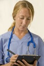 Nurse writing prescription