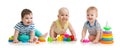 Nursery babies playing with toys isolated on white background