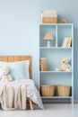 Nursery interior. Bed, toys, photo frame backdrop. Boys blue bedroom. Children's Playroom Royalty Free Stock Photo