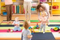 Kids or children playing in kindergarten room Royalty Free Stock Photo