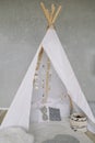 Nursery in Scandinavian style. Scandi child room interior in real photo. Decorative boho styled hut, tipi, wigwam Royalty Free Stock Photo