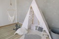 Nursery in Scandinavian style. Scandi child room interior in real photo. Decorative boho styled hut, tipi, wigwam Royalty Free Stock Photo