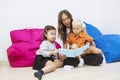 Nursery teacher reads story book to kids Royalty Free Stock Photo