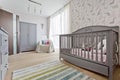 Nursery with wooden grey cradle Royalty Free Stock Photo