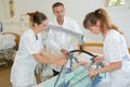 Nurses moving patient with hoist Royalty Free Stock Photo