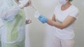 Nurses open the package with sterile gloves for doctor before surgery in hospital