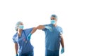 Nurses in scrubs elbow bump instead of shaking hands during COVID-19 pandemic
