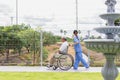 Nursing Home Care concept. asian Young nurse disabled elderly man. Nurse, care home and elderly man with disability in a