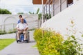 Nursing Home Care concept. asian Young nurse disabled elderly man. Nurse, care home and elderly man with disability in a
