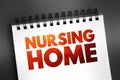 Nursing home - facility for the residential care of elderly or disabled people, text concept on notepad