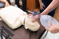 CPR training with CPR doll and Am-bu bag for ventilation resuscitation. Royalty Free Stock Photo