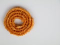 Nurukku or murukku a traditional Kerala snack made of rice powder in white background, isolated ,  selective focus Royalty Free Stock Photo