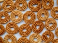 Nurukku or murukku a traditional Kerala snack made of rice powder   as texture, background Royalty Free Stock Photo