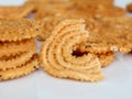 Nurukku or murukku a traditional Kerala snack made of rice powder in white background, isolated ,  selective focus Royalty Free Stock Photo