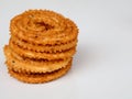 Nurukku or murukku a traditional Kerala snack made of rice powder in white background, isolated,  selective focus Royalty Free Stock Photo