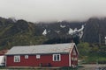 Nusfjord, Norway - May 28, 2015: Dried codfish hanging from the facade of a house in a fishing village Royalty Free Stock Photo