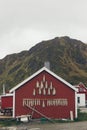 Nusfjord, Norway - May 28, 2015: Dried codfish hanging from the facade of a house in a fishing village Royalty Free Stock Photo