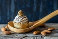 Nut cake over wooden spoon dark food